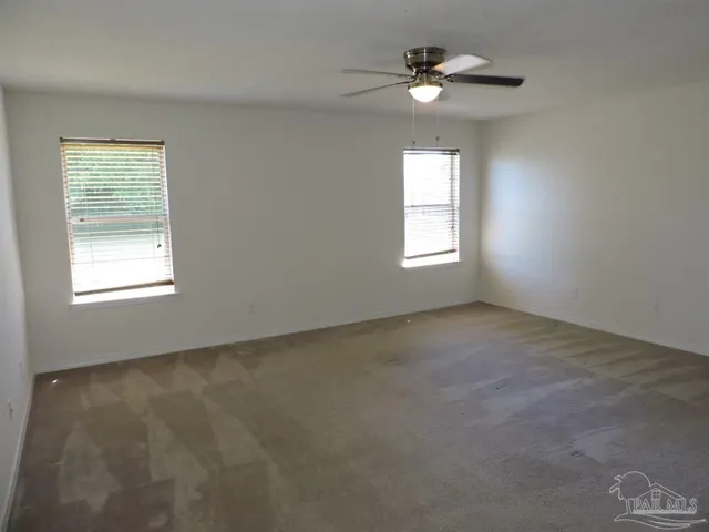 a view of an empty room with a window