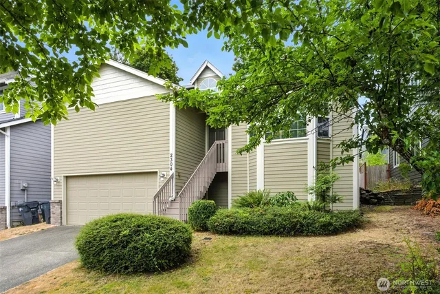a view of a house with a yard and plants