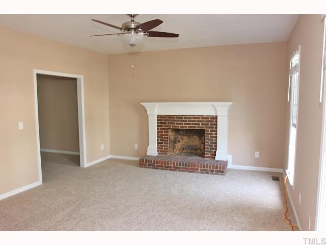 4320 Bartholomew Circle Raleigh, NC 27604 - Photo 4 of 11 a view of an empty room with a fireplace