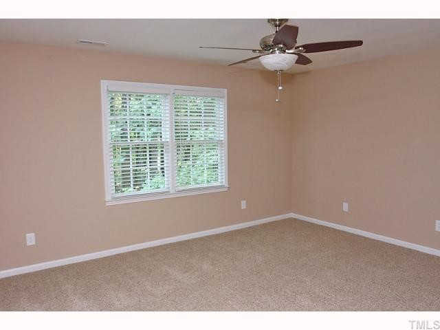 4320 Bartholomew Circle Raleigh, NC 27604 - Photo 5 of 11 a view of an empty room with a window