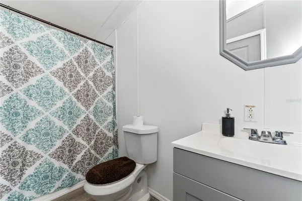 a bathroom with a toilet and a sink