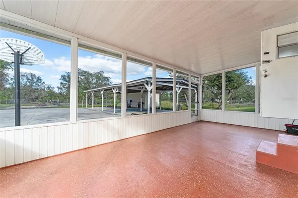 a view of an empty room with a large window