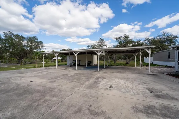 a view of a house with backyard and a garden