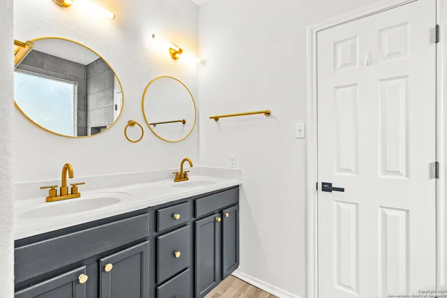 a bathroom with a sink and a mirror