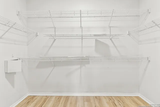 a view of a room with racks on the wall