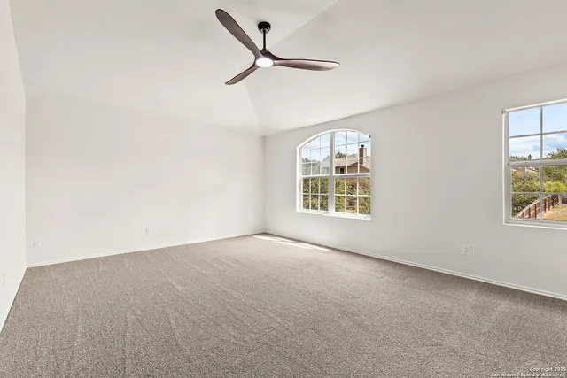 a view of an empty room with a window