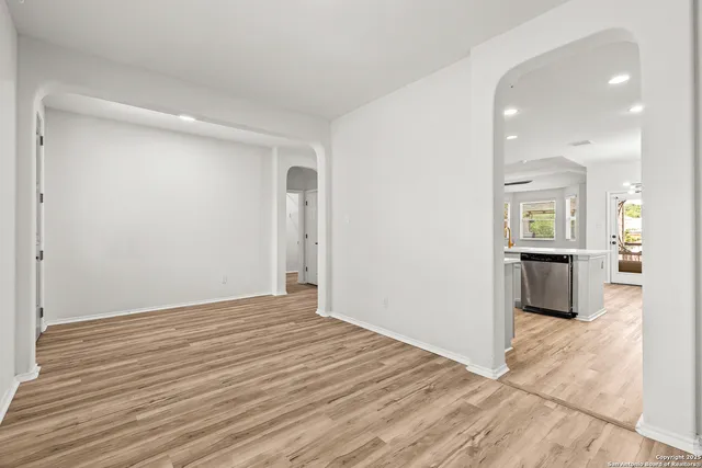 a view of a kitchen cabinets and wooden floor