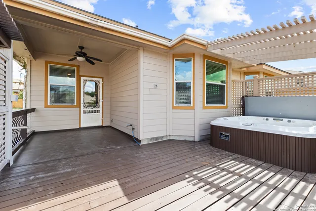 a view of a house with a barbeque and wooden floor