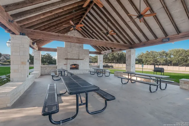 a view of a swimming pool with a patio