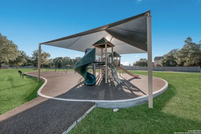 a view of swimming pool with a patio