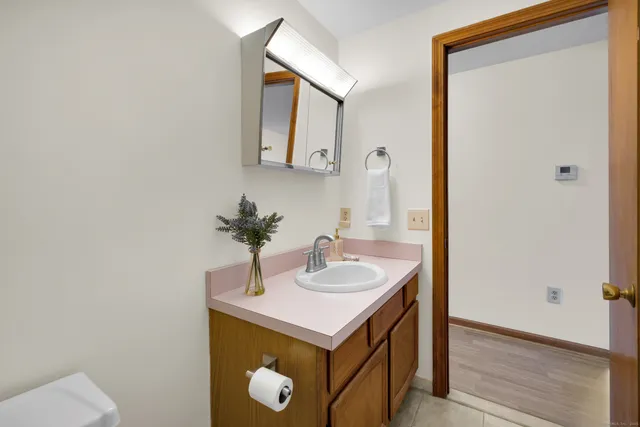 a bathroom with a sink and a mirror