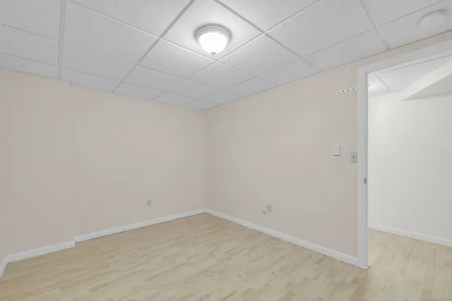 an empty room with a empty space and a window