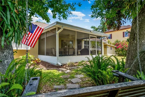 a view of a house with potted plants