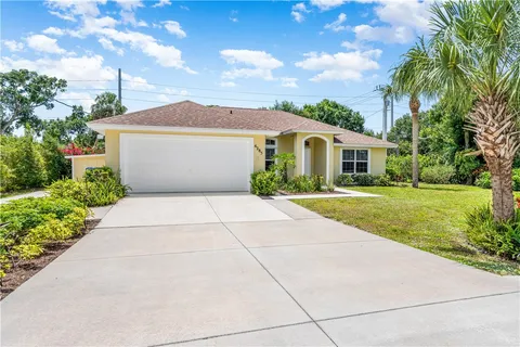 a front view of a house with yard