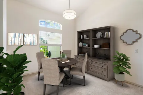 a workspace with furniture and a potted plant