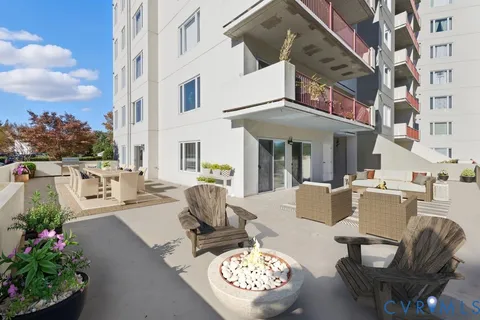 a swimming pool with outdoor seating