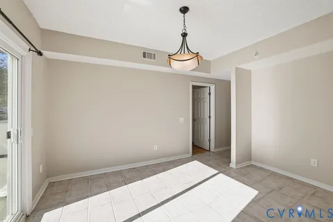 a kitchen with stainless steel appliances granite countertop a stove microwave and cabinets