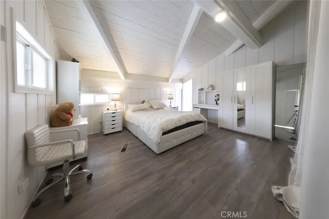 a view of a house with wooden fence