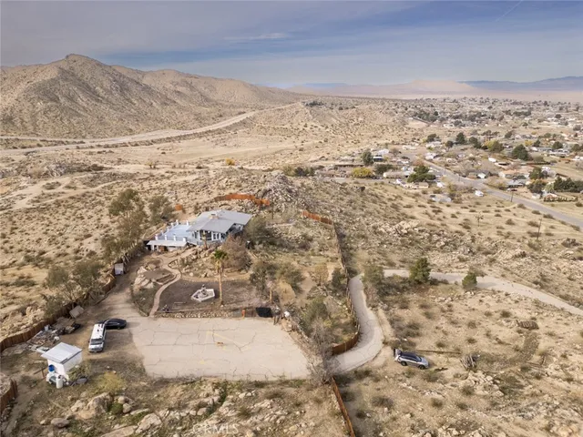 a very nice looking room with wooden floor and a large window