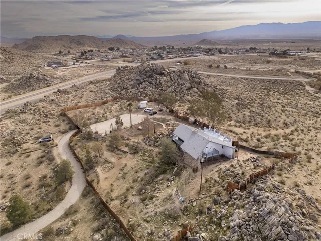 a view of a livingroom with furniture and mirror
