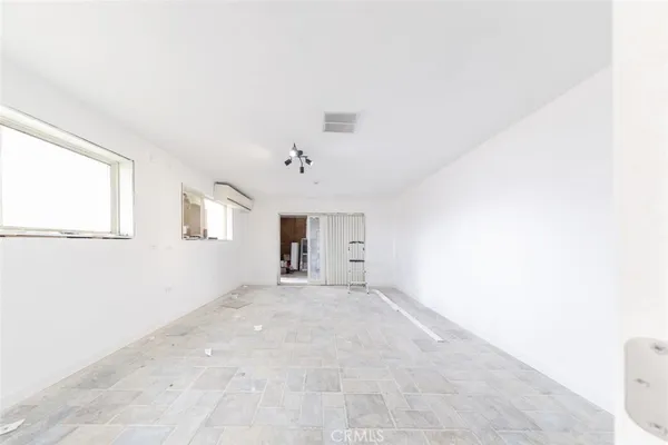 wooden floor in an empty room with a mirror
