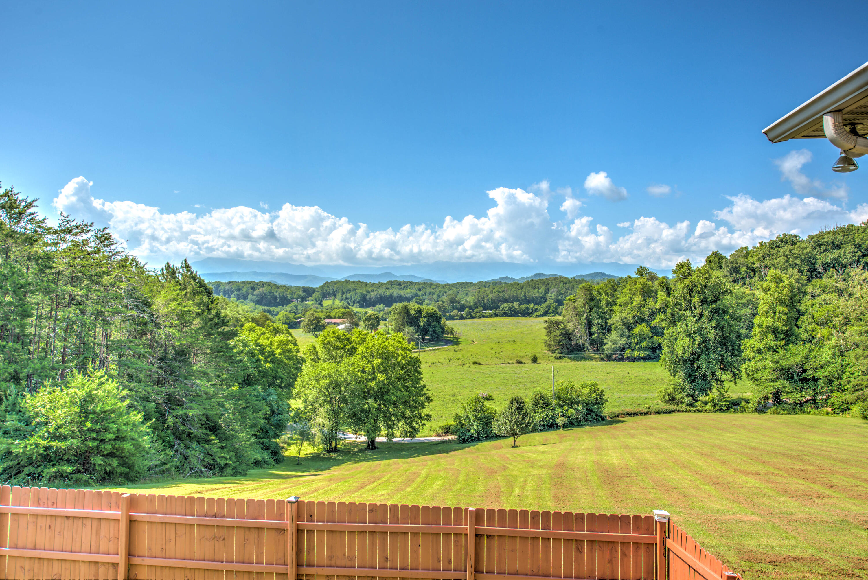 957 English Mountain Road Cosby, TN 37722 - Photo 22 of 37 BACK YARD IS PARTIALLY FENCED