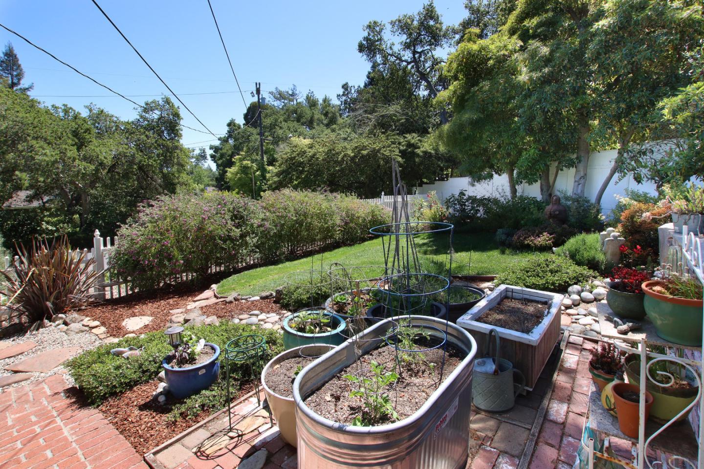 2 Deer Path Road Santa Cruz, CA 95060 - Photo 11 of 44 a backyard of a house with fountain table and chairs