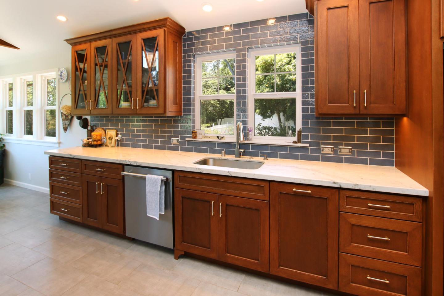 2 Deer Path Road Santa Cruz, CA 95060 - Photo 17 of 44 a kitchen with stainless steel appliances granite countertop wooden cabinets a sink and a large window