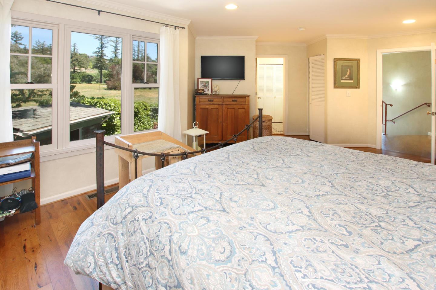 2 Deer Path Road Santa Cruz, CA 95060 - Photo 26 of 44 a bedroom with a bed and a flat screen tv