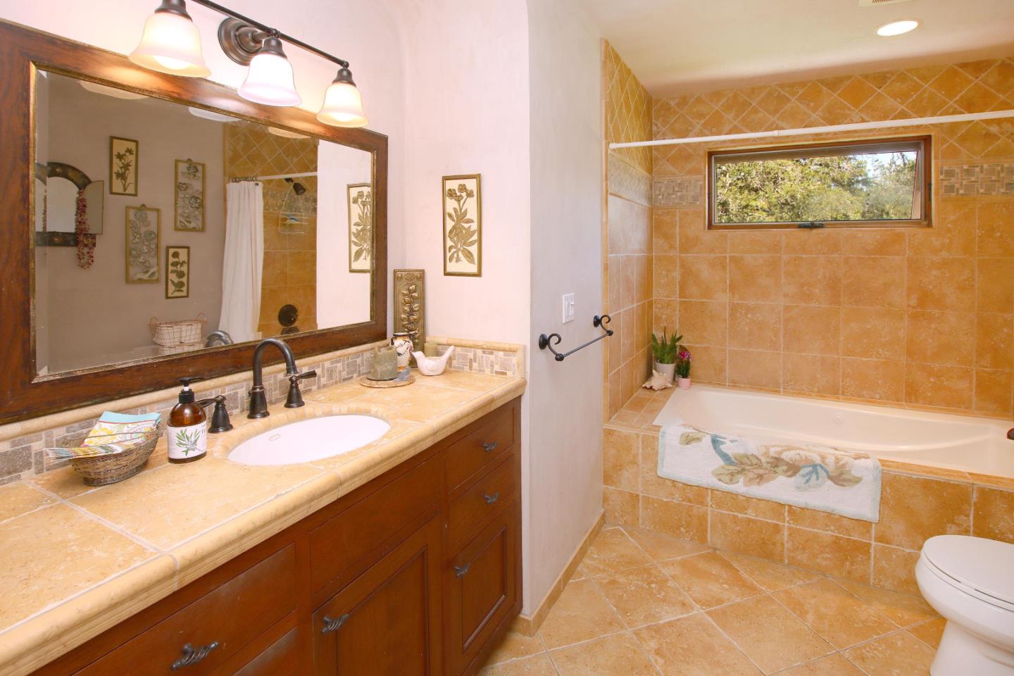 2 Deer Path Road Santa Cruz, CA 95060 - Photo 33 of 44 a bathroom with a granite countertop sink mirror toilet and bathtub