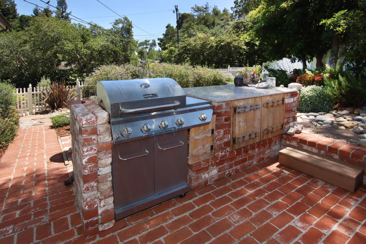 2 Deer Path Road Santa Cruz, CA 95060 - Photo 37 of 44 a view of a patio with table and chairs with wooden floor and fence
