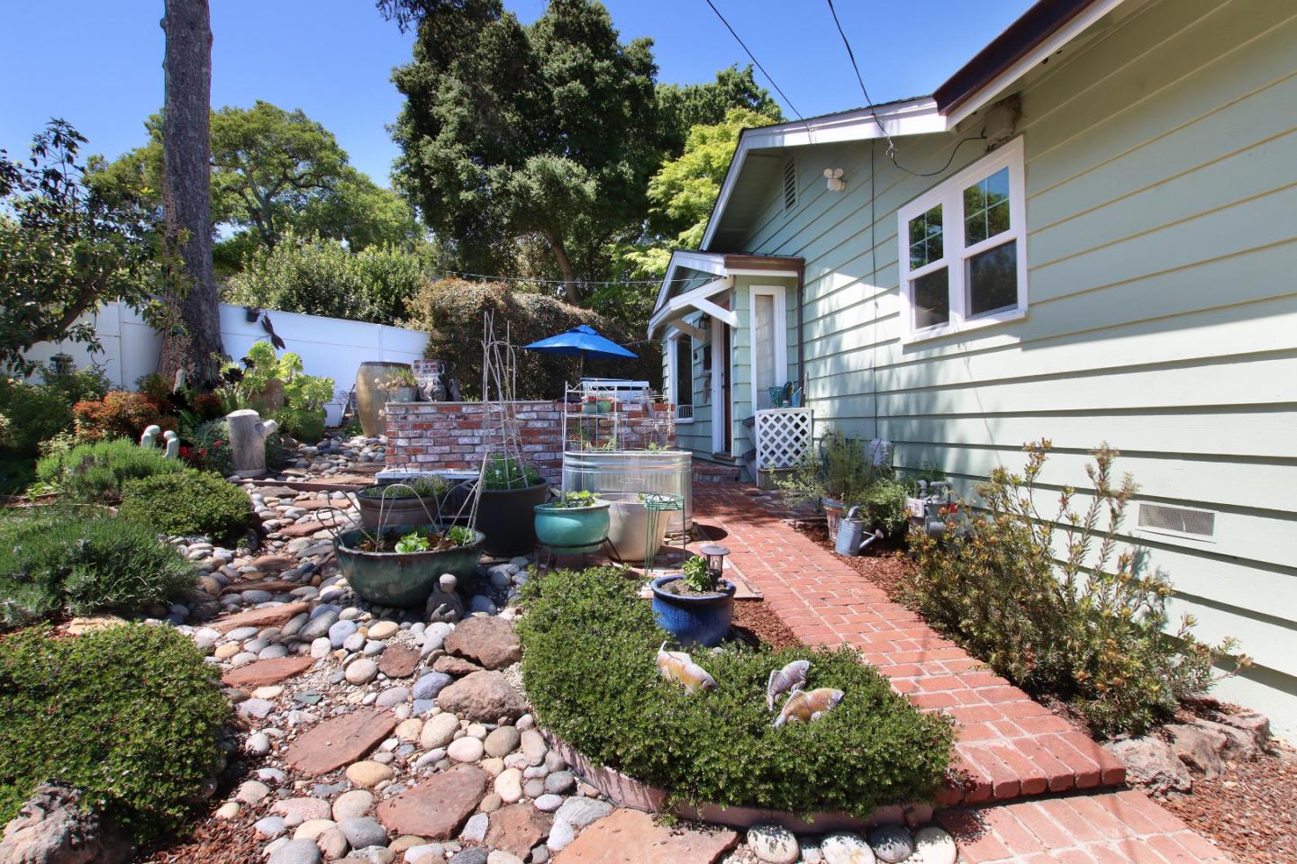 2 Deer Path Road Santa Cruz, CA 95060 - Photo 10 of 44 a view of a house with a backyard and garden
