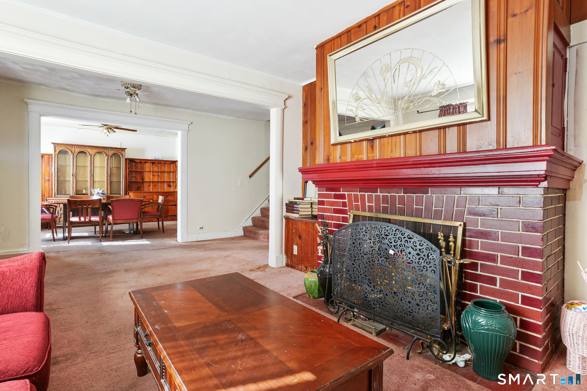 570 Broadview Terrace Hartford, CT 06106 - Photo 13 of 30 a living room with furniture a flat screen tv and a fireplace