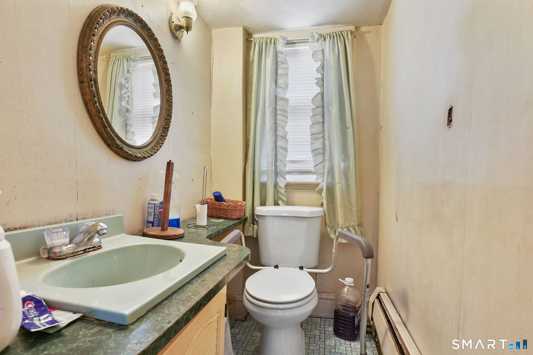 570 Broadview Terrace Hartford, CT 06106 - Photo 17 of 30 a bathroom with a sink toilet and a mirror