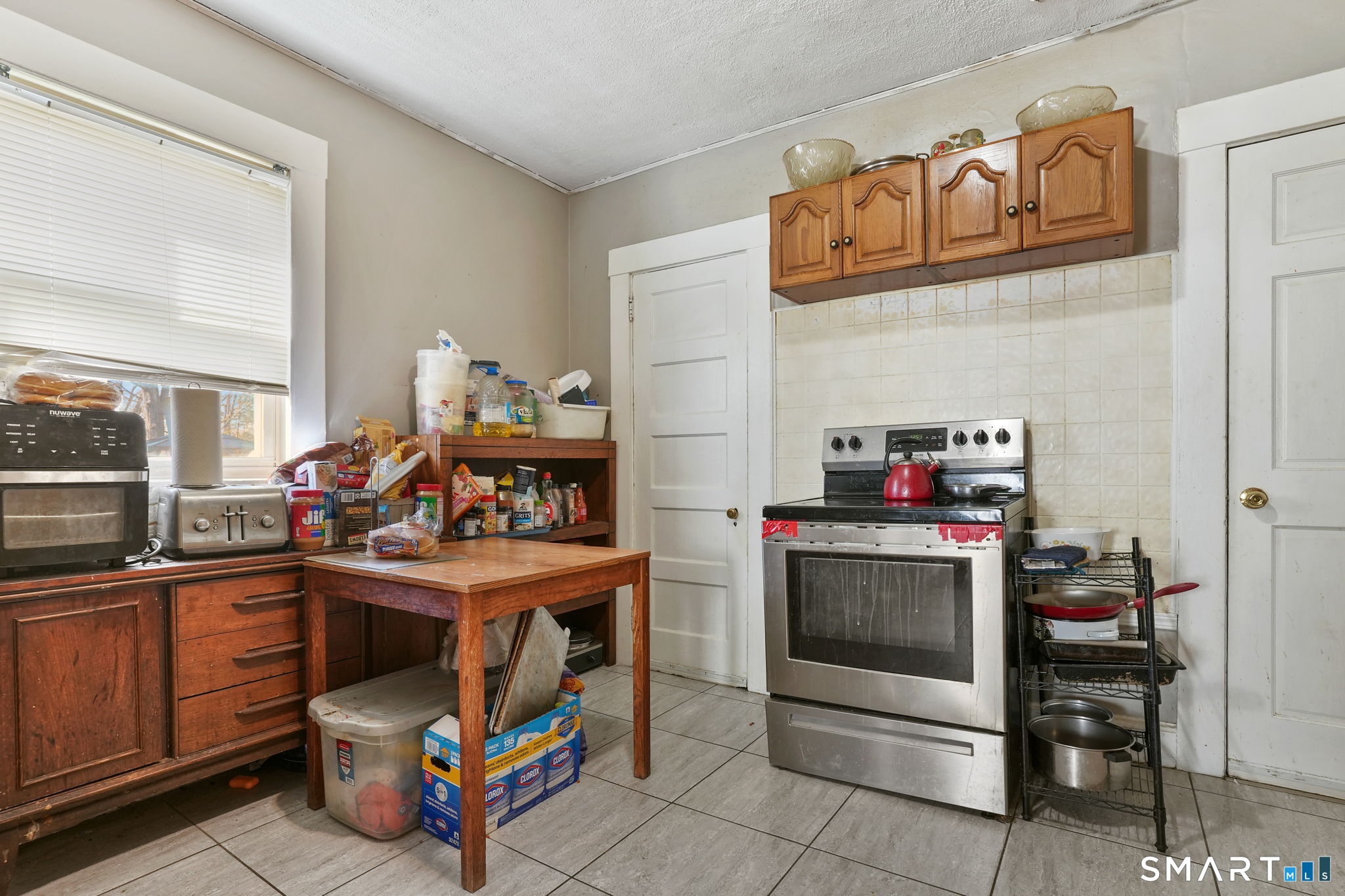 570 Broadview Terrace Hartford, CT 06106 - Photo 21 of 30 a kitchen with a stove and a microwave