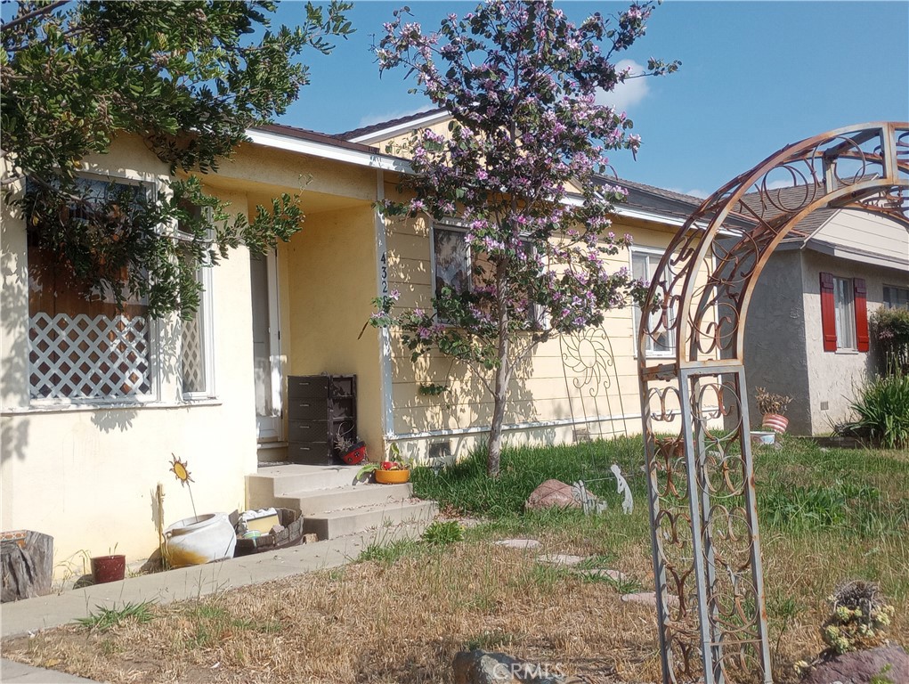 4328 Deeboyar Avenue Lakewood, CA 90712 - Photo 2 of 2 a backyard of a house with table and chairs