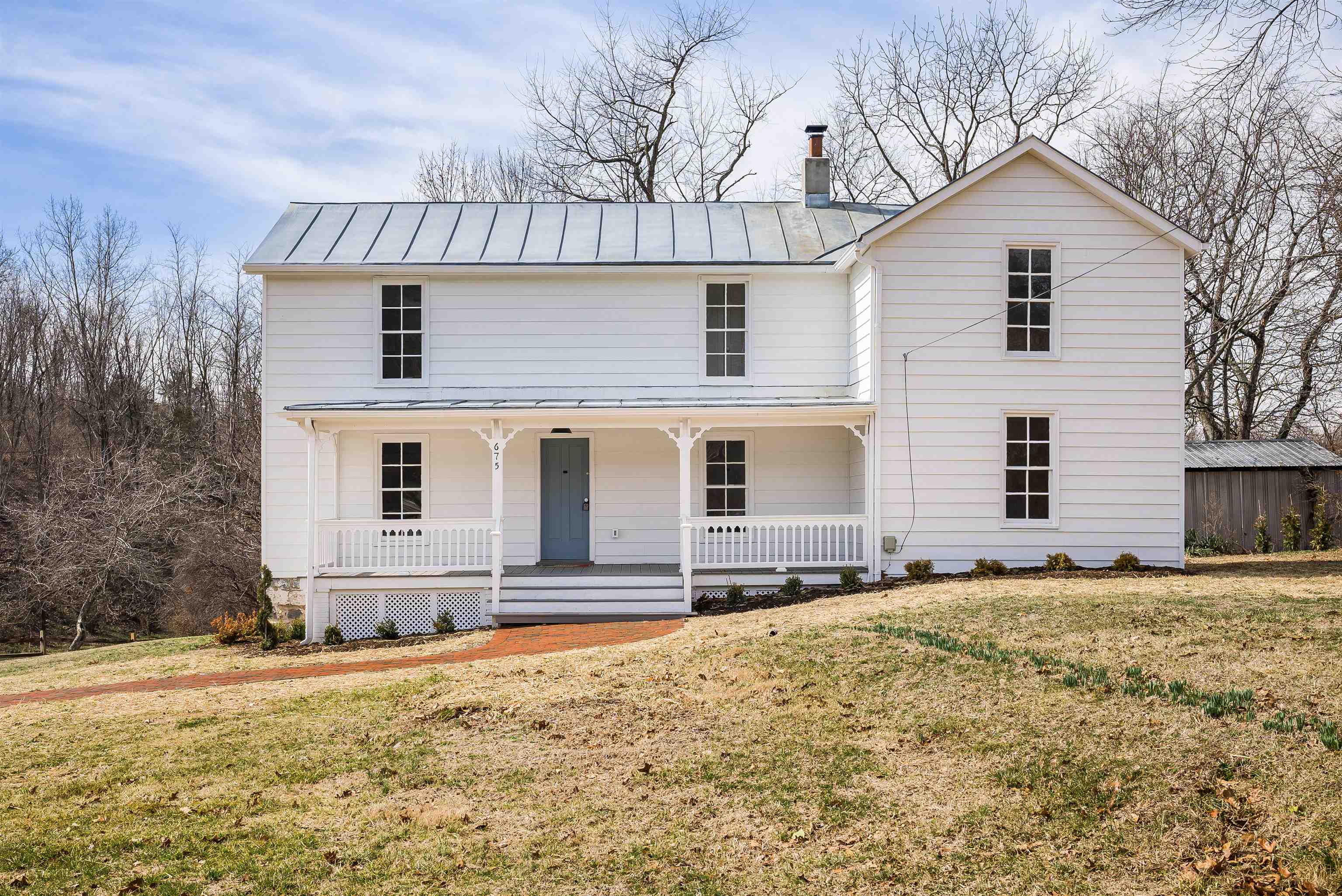 675 Stone Spring Road Harrisonburg, VA 22801 - Photo 1 of 39 a front view of a house with a yard