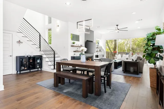 a kitchen with stainless steel appliances kitchen island granite countertop a sink stove and cabinets