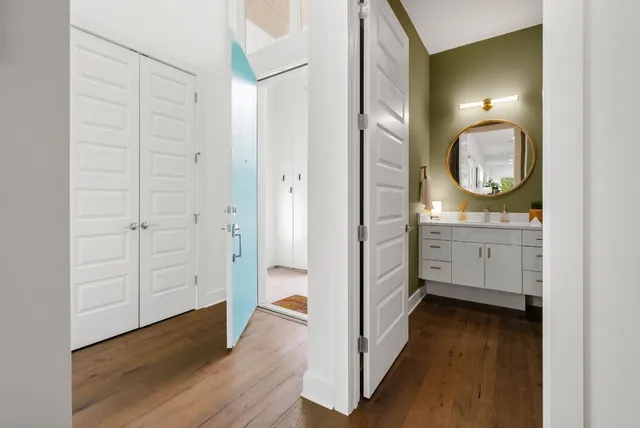 a bathroom with a sink mirror and vanity