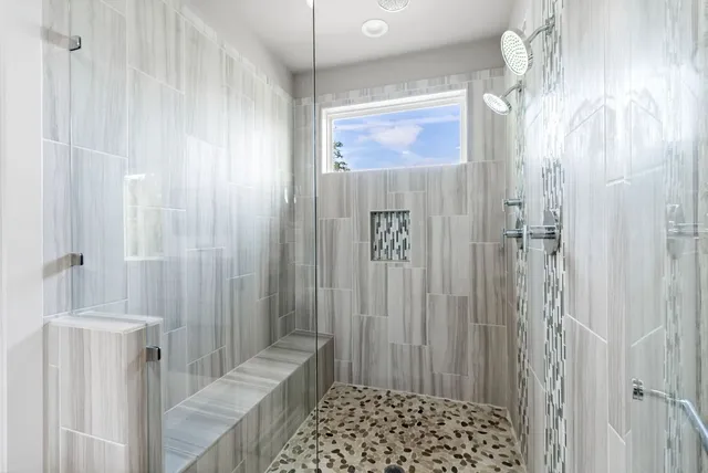a bathroom with a double vanity sink and a mirror