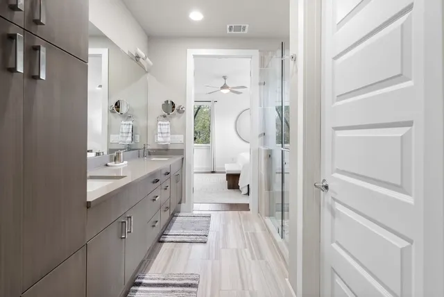 a bathroom with a shower and a sink