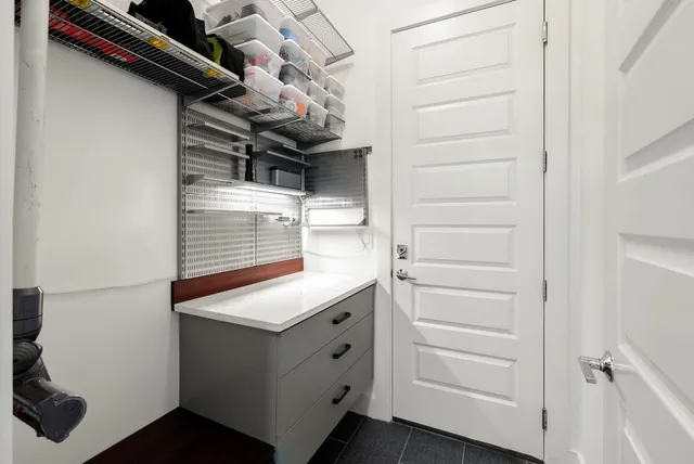 a bedroom with bed and a flat tv screen