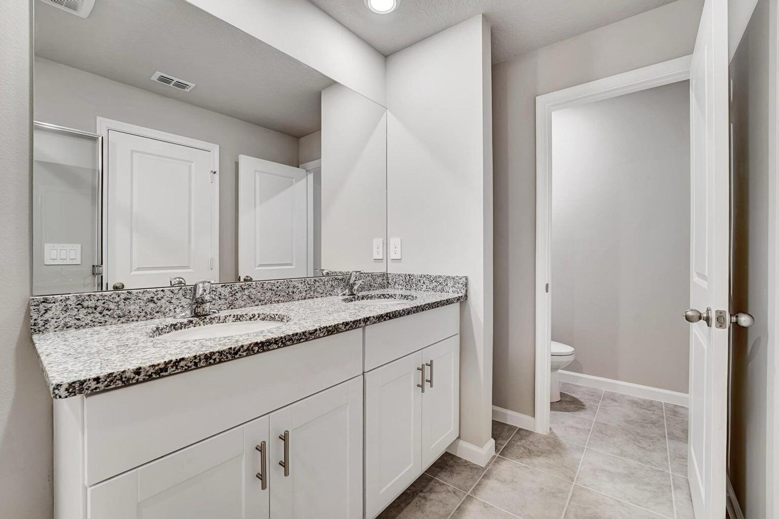 5748 Southeast Edgewater Circle Stuart, FL 34997 - Photo 14 of 36 Primary Bathroom