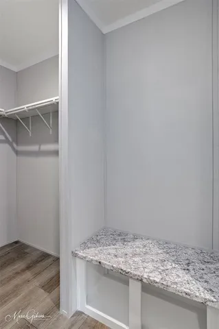 a bathroom with a granite countertop sink and vanity