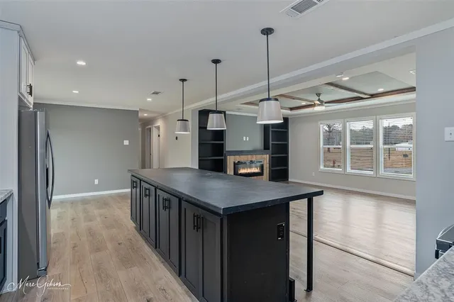 a kitchen that has a lot of cabinets in it