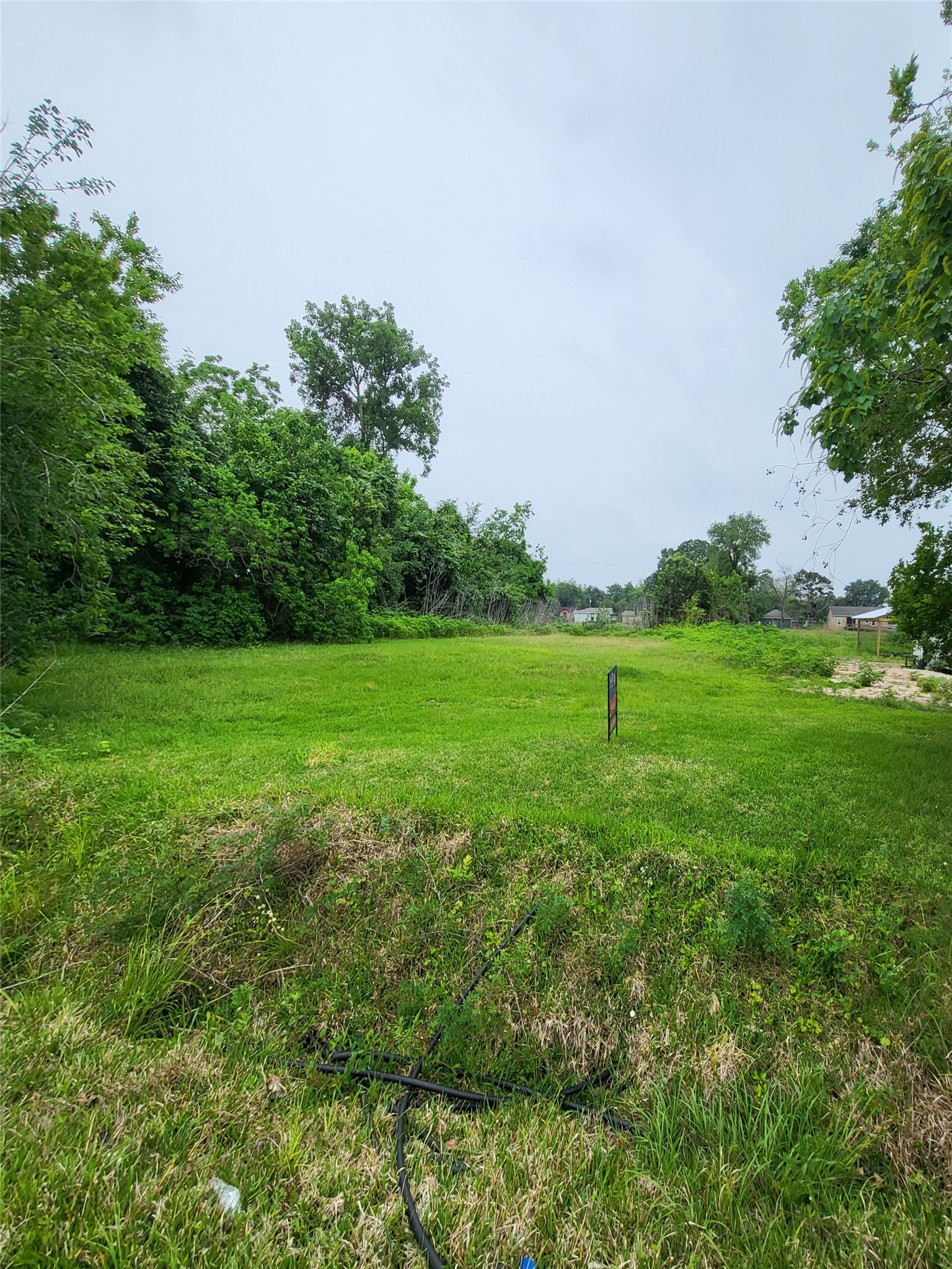 0 Kansas Street La Marque, TX 77568 - Photo 16 of 16 a view of a grassy field with trees