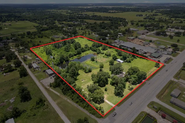 a view from a balcony with wooden floor and outdoor space