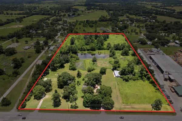 an aerial view of house with yard