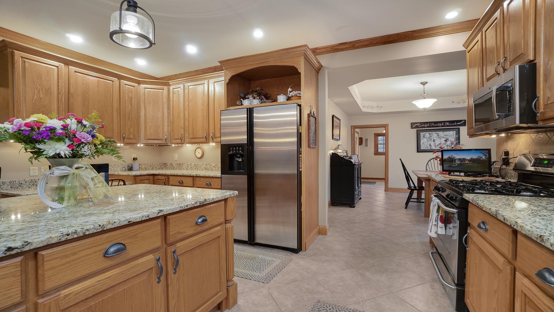 1921 Wildcat Road Dixon, IL 61021 - Photo 16 of 63 a kitchen with stainless steel appliances granite countertop a refrigerator a stove and a sink