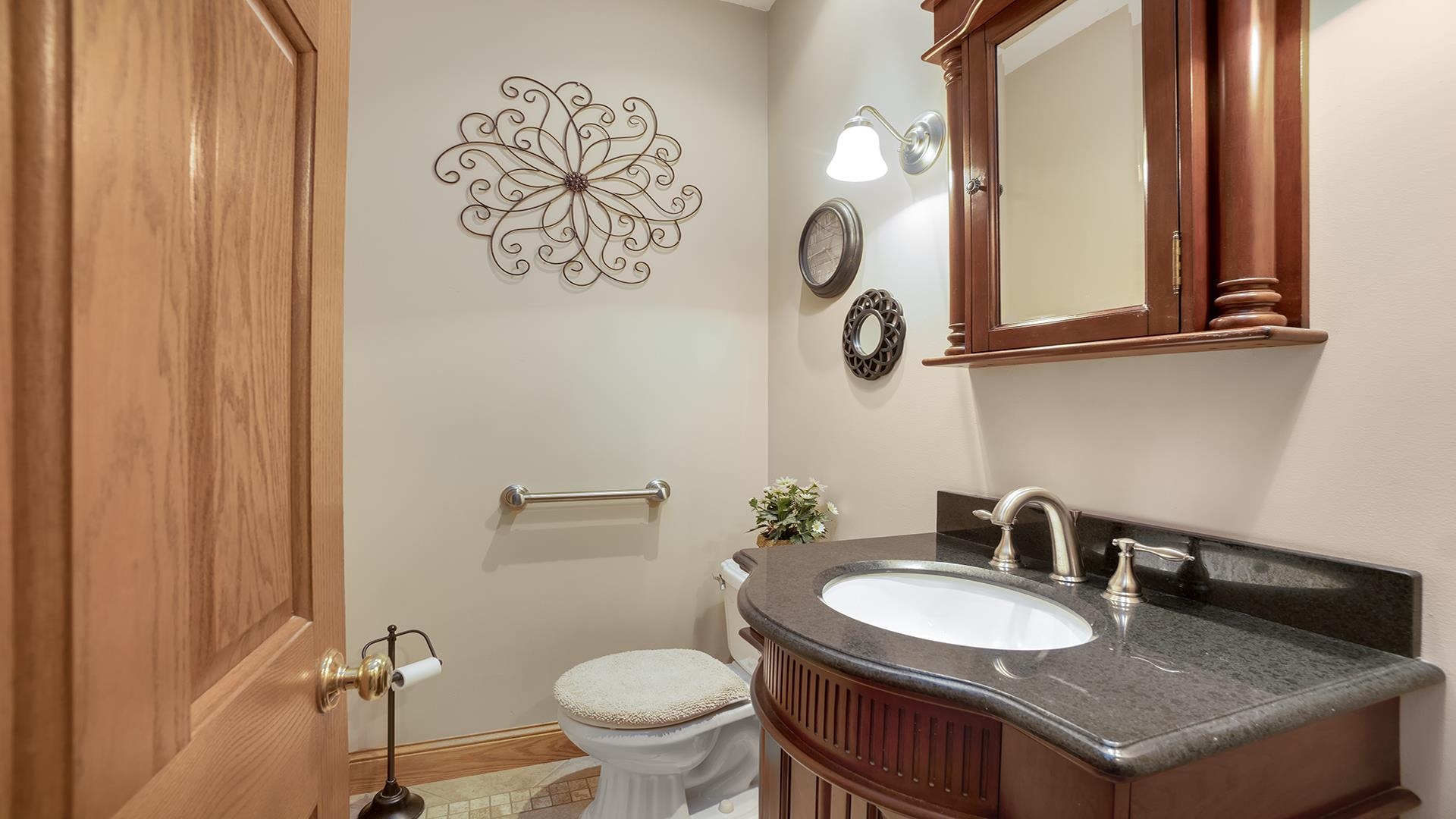 1921 Wildcat Road Dixon, IL 61021 - Photo 21 of 63 a bathroom with a granite countertop sink and a toilet